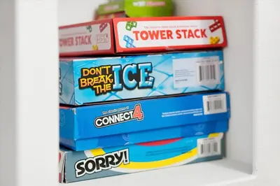 a stack of cereal boxes sitting on a shelf at Themed Villa with Private Pool, Game Room, Resort Amenities, BBQ in Orlando