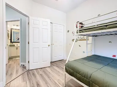a small bedroom with a bunk bed and a bunk bed at 3BR Family-Friendly Town Home Near Disney in Orlando