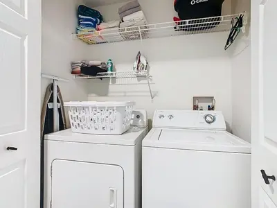 a laundry room with a washer and dryer at 3BR Family-Friendly Town Home Near Disney in Orlando