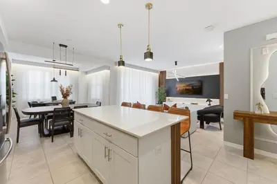 a kitchen and dining room with a table and chairs at 207 Storey Lake 6 Guests 2 BDRS near clubhose in Kissimmee