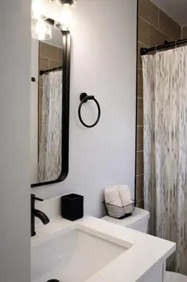 a bathroom with a sink and a mirror at Spacious Casselberry Home Near Attractions in Orlando