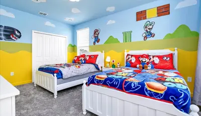 a childs bedroom with two beds and mickey mouse mural at Pool & BBQ | Disney-Themed Cozy 6BD | Near Disney in Kissimmee