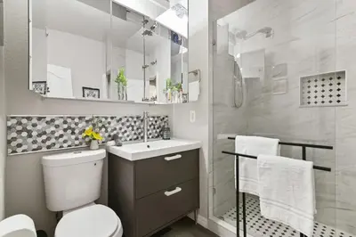 a bathroom with a toilet and a sink and a shower at Restpool vibes, Nest tree-ish Retreat- NxtDisney in Kissimmee
