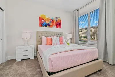 a bedroom with a pink bed and a window at Discover Your Escape - NEW house wPrivate Pool in Orlando
