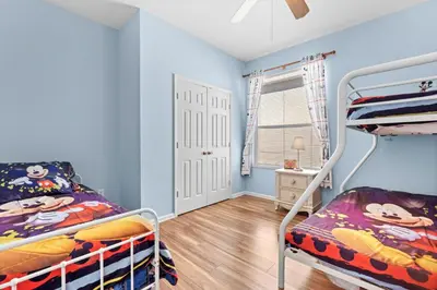 a bedroom with two bunk beds and a window at Windsor Palms 3BR FUN Retreat, Pool, Near Disney in Kissimmee
