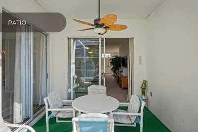 a dining room with a white table and chairs at Cozy 3BR Family Home Minutes from Disney in Kissimmee