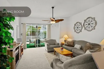 a living room with a couch and a tv at Cozy 3BR Family Home Minutes from Disney in Kissimmee