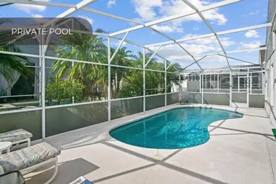 a swimming pool on a balcony of a building at Cozy 3BR Family Home Minutes from Disney in Kissimmee