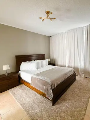 a bedroom with a bed and a ceiling fan at 7 Bd/ 5.5 Ba- Terra Verde Resort -Near Disney in Kissimmee