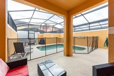 a view from the balcony of a house with a swimming pool at Four Bedroom Private Pool Townhome, near Disney in Kissimmee
