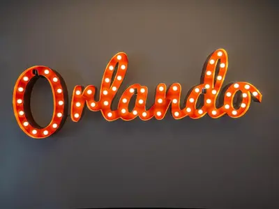 a sign shaped like the word love with lights at The Enchanted luxe Townhome in Kissimmee