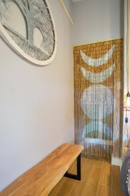 a room with a wooden bench on a wall at Lake view that is 10mins to Downtown and Parks for 2 Guests in Orlando