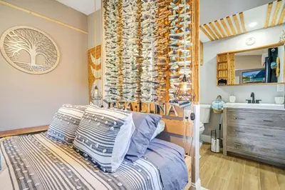 a bedroom with a bed with a wooden headboard at Lake view that is 10mins to Downtown and Parks for 2 Guests in Orlando