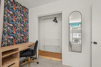 a home office with a desk and a mirror at Game Filled Orlando Retreat with Patio and Grill in Orlando