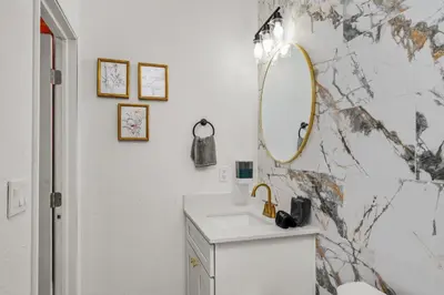 a bathroom with a sink and a mirror at Charming Private Studio Near Everything Orlando in Orlando