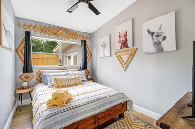 a bedroom with a bed and a window at Fireplace and Lake View Just 10 Minutes to Downtown Near Parks in Orlando