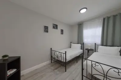 a bedroom with two beds and a window at Cozy 2 bedroom home in Orlando in Orlando