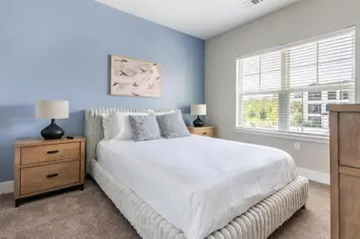 a bedroom with a white bed and a window at Landing Incredible 1BD Clubhouse Gym in Orlando