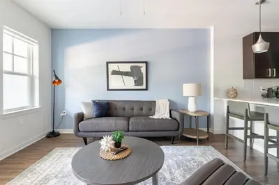 a living room with a couch and a table at Landing Beautiful 2BD in Kissimmee in Kissimmee