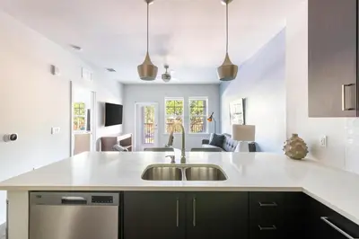 a kitchen with a sink and a counter top at Landing Beautiful 2BD in Kissimmee in Kissimmee