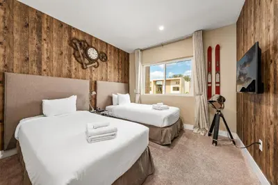 a hotel room with two beds and a window at Bright and Modern Townhome at Magic Village – Superb Disney Location in Orlando