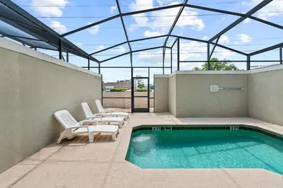 a swimming pool on the roof of a building at Chic Resort Getaway – 15 Min to Disney in Kissimmee