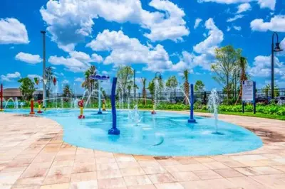 a water park with fountains in the middle at Chic Resort Getaway – 15 Min to Disney in Kissimmee