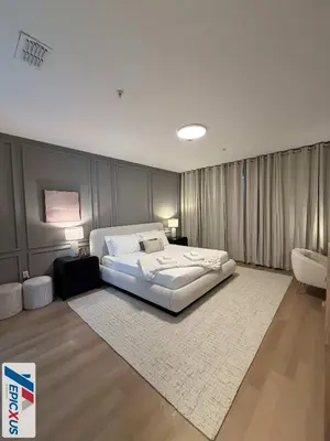 a bedroom with a large bed and a white rug at The Epic 11 Vista Cay Resort Orlando Florida in Orlando