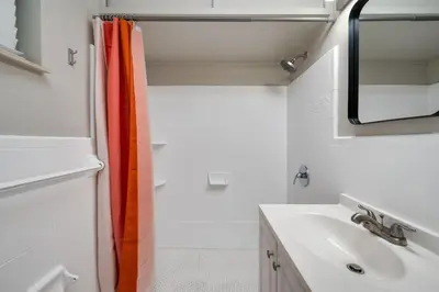 a bathroom with a sink and a mirror at Stylish 2BR Home Near Disney and Universal Orlando in Orlando