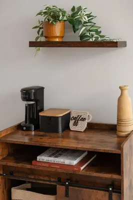a wooden shelf with a coffee maker and a plant at Chic Studio Near Downtown & Theme Parks in Orlando