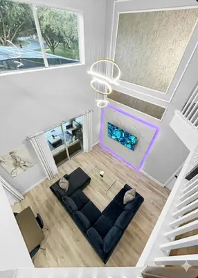 an overhead view of a living room with a couch at NEW Luxury 7BR Villa 4 Mi to Disney Pool & Spa in Kissimmee