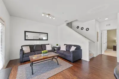 a living room with a couch and a table at 8925 Resort 4BR Townhouse by Disney World Orlando in Kissimmee