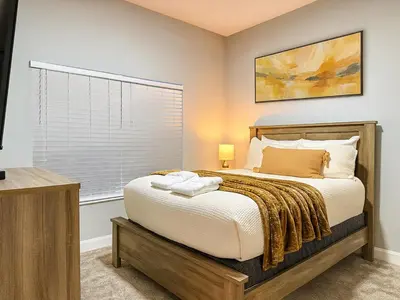 a bedroom with a bed and a window at 4263PD-New Listing- 5 bed/4 bath-Private Pool in Kissimmee