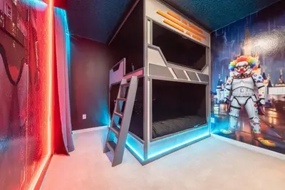 a bedroom with a captain america bunk bed and a mural at 2026 NEW Home 8 Bedrooms At Bella Vida in Kissimmee