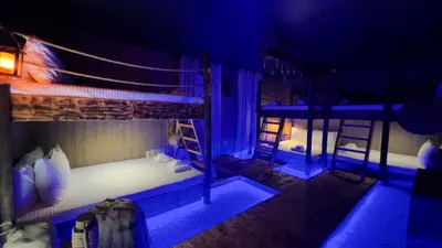 two bunk beds in a room with blue lights at 4573TB-New Listing- 10bed/5 bath-Private Pool in Kissimmee