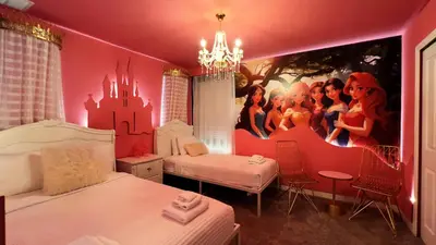 a bedroom with a disney princess mural on the wall at 4573TB-New Listing- 10bed/5 bath-Private Pool in Kissimmee