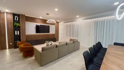 a living room with a couch and a flat screen tv at 6277SK-New Brand-12bed/11.5bath-Private Pool&SPA in Orlando