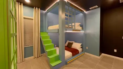 a room with a bunk bed with a ladder at 6277SK-New Brand-12bed/11.5bath-Private Pool&SPA in Orlando