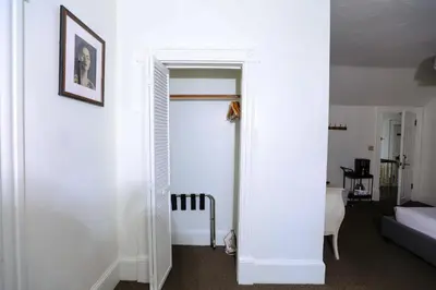 a white room with a door leading to a bedroom at Norment Parry by The Wellborn in Orlando