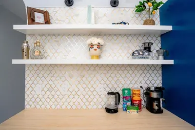 a kitchen with white shelves and a wooden counter top at Spacious Orlando Getaway Vacation Home in Orlando