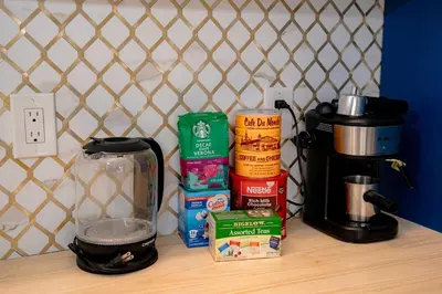 a counter with a coffee maker and some food on it at Spacious Orlando Getaway Vacation Home in Orlando