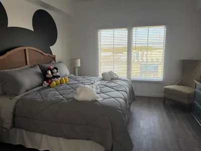 a bedroom with a bed with stuffed animals on it at Magical Condo 3 bedroom in Orlando