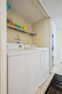 a washer and dryer in a laundry room at Near Disney! Pool and Hot Tub with Free Parking in Kissimmee