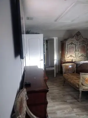 a living room with a couch and a table at A great environment living space in Orlando