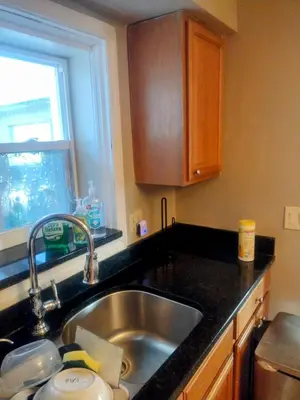 a kitchen with a sink and a window at A great environment living space in Orlando