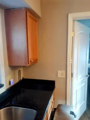 a kitchen with a sink and a counter top at A great environment living space in Orlando