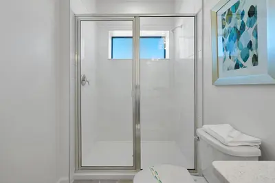 a bathroom with a shower and a toilet at New 5BR Villa Near Disney I Resort Lazy River in Orlando