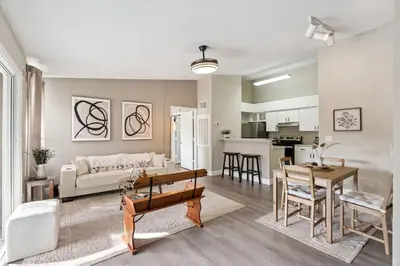 a living room with a couch and a table at Quiet Gated Condo Near Universal with Pool and View in Orlando