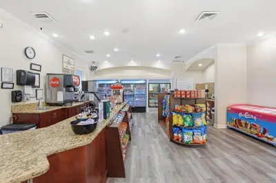 a grocery store with a counter in a store at Magic Palms House 10 Min to Parks in Kissimmee