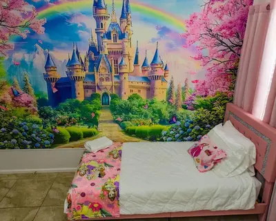 a bedroom with a disney castle mural at Magic Palms House 10 Min to Parks in Kissimmee